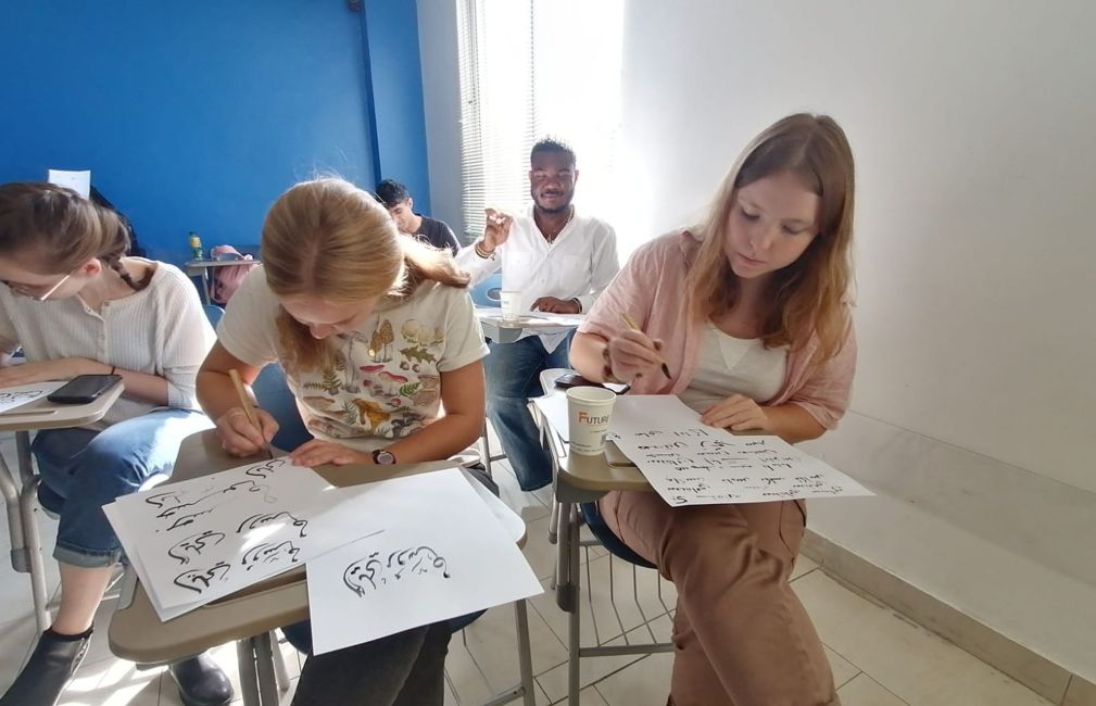 girls studying abroad in middle east classroom