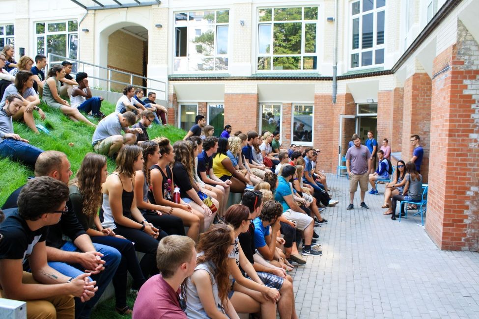 students in class on outdoor terrace