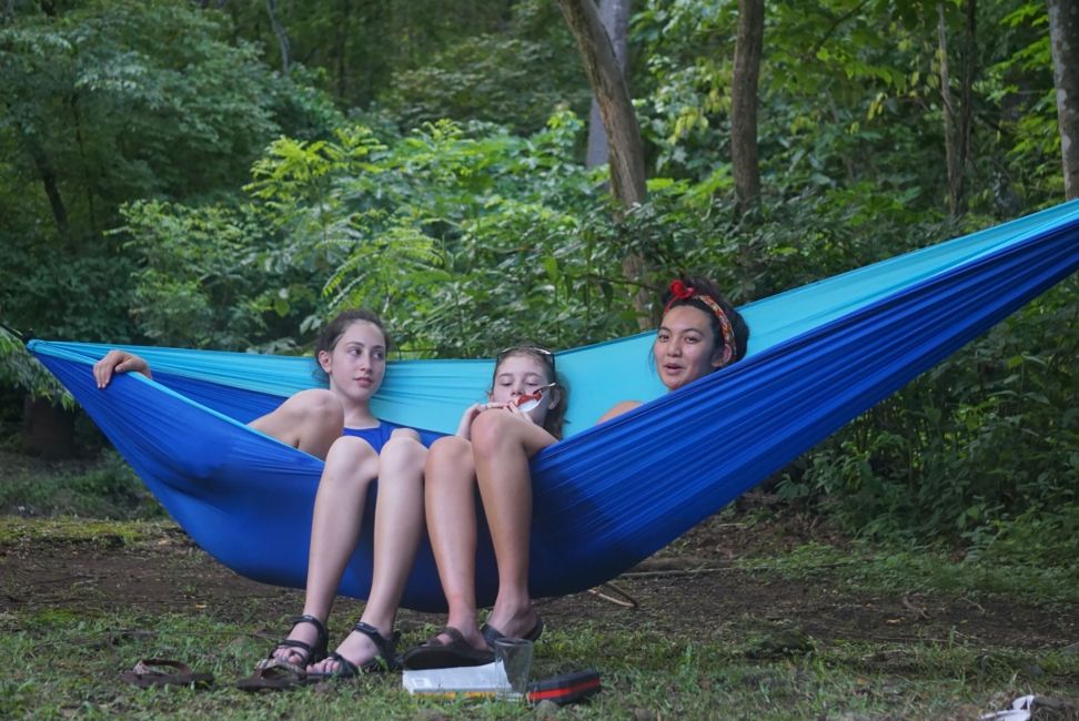 Gap year abroad students sitting in hammock