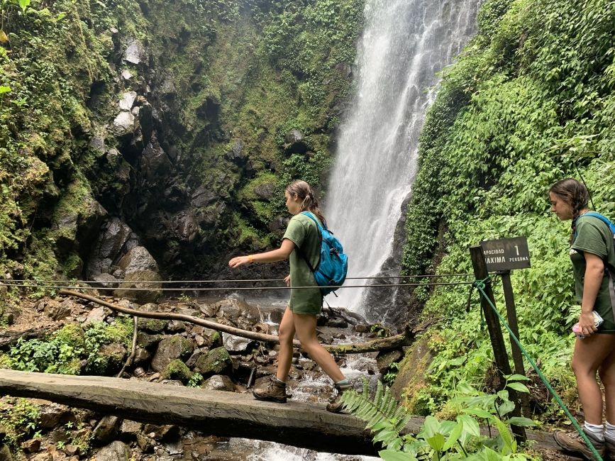 Student hiking across bridge in Monteverde