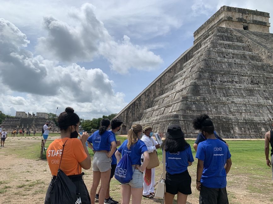 High school students looking at ancient pyramid in the Yucatan