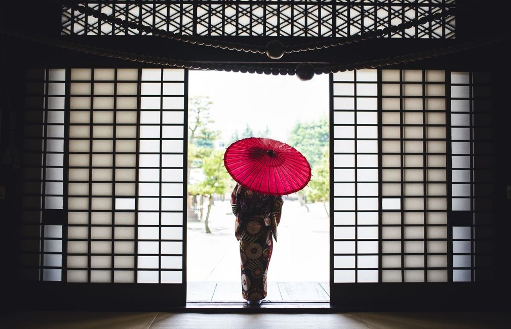kimono and umbrella at temple in kyoto