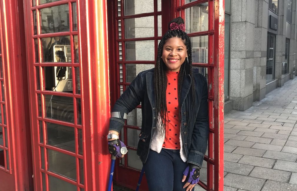 girl by red telephone booth in london