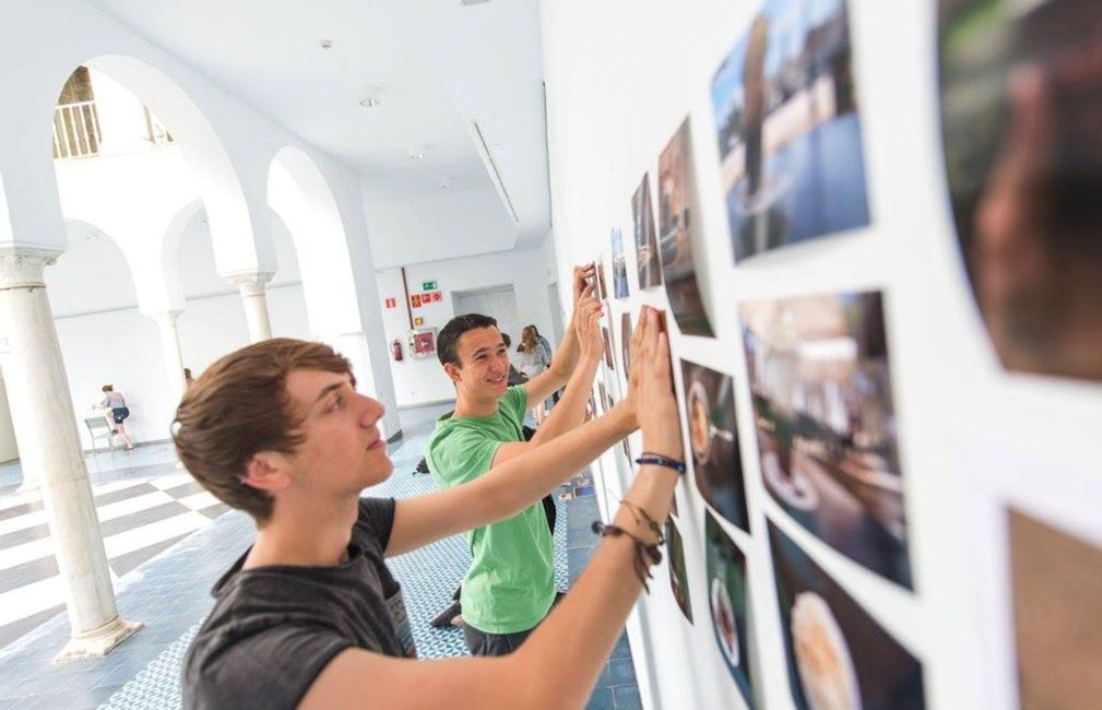 seville photo wall study abroad students hanging photos