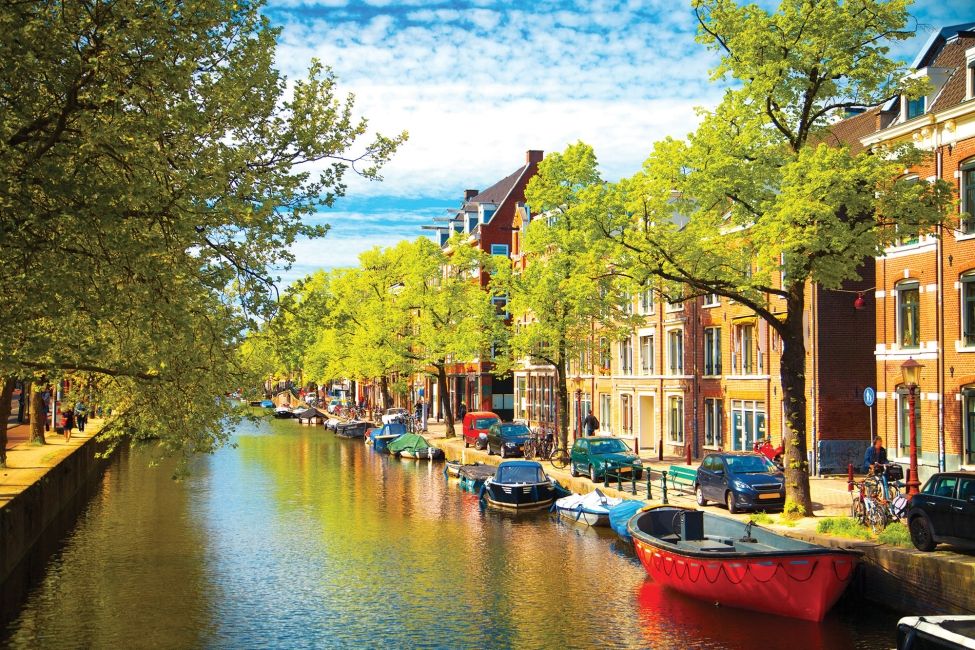 amsterdam river boats trees