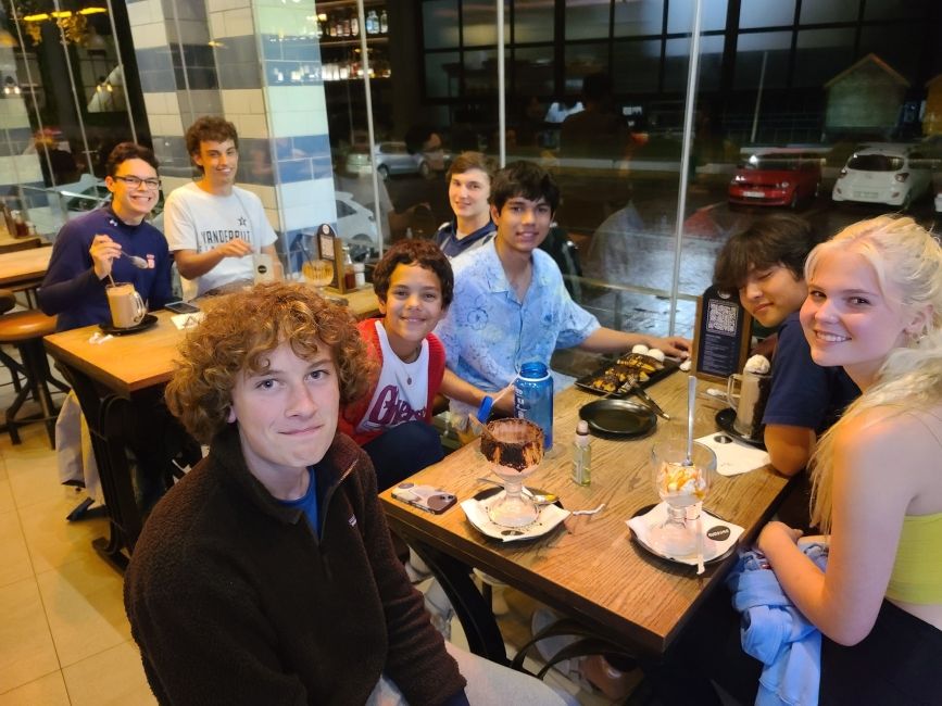 High school students dining together at a table in Cape Town