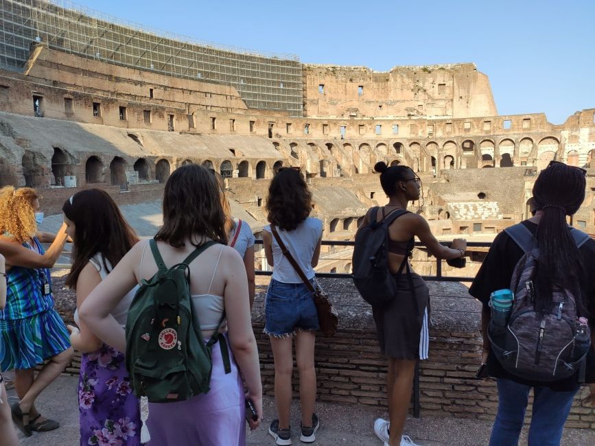 High school students looking out on interior of colosseum in Rome
