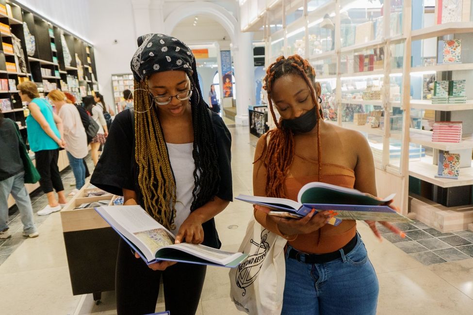 High school students browsing books in London bookshop