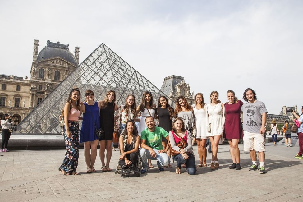 Paris group of students at the Louvre Pyramid