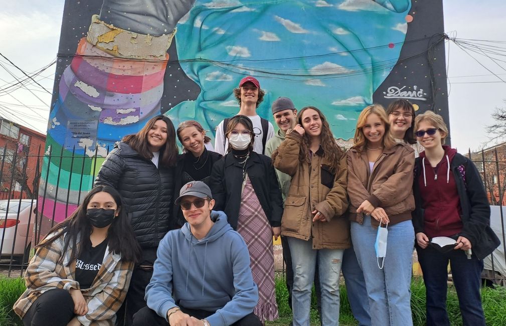 students in santiago chile by wall painting