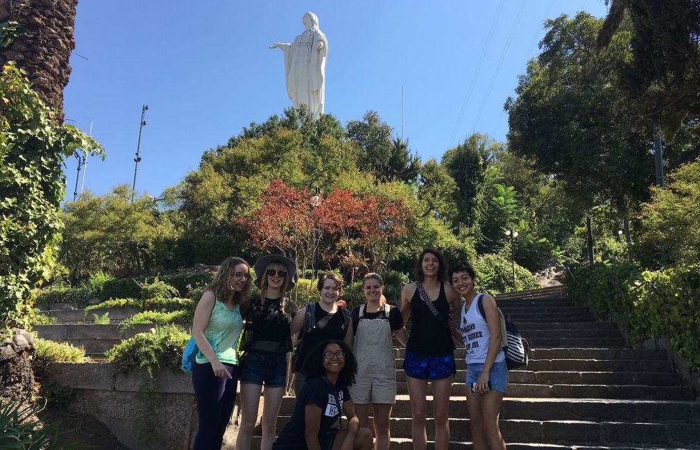 students by statue in santiago chile park