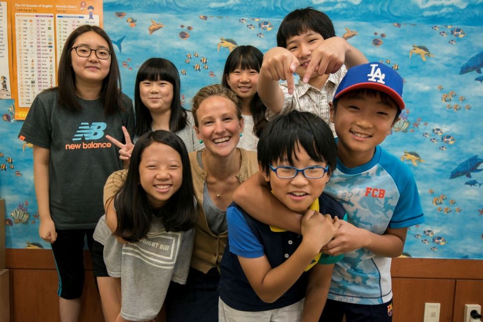 Teach in South Korea teacher with her students