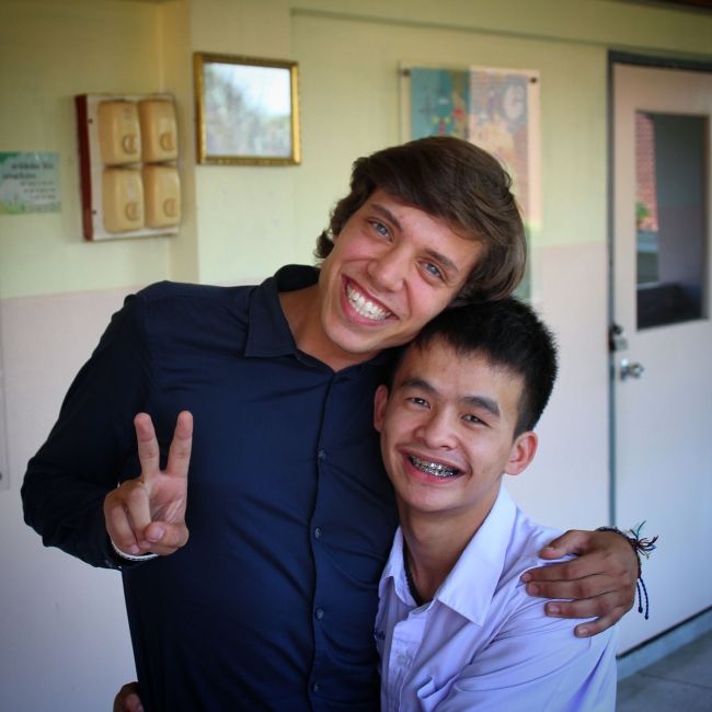 Teach in Thailand teacher with student