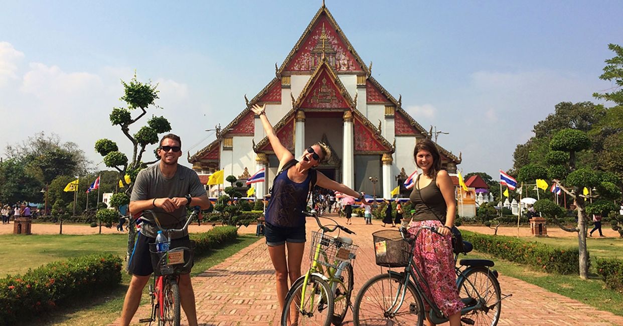 Teachers with bicycles on an outing at a temple in Thailand