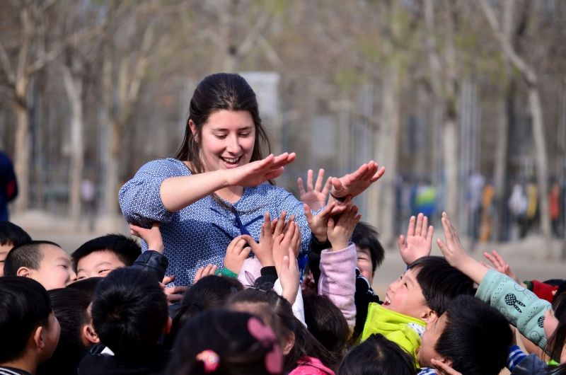 Female teacher with students