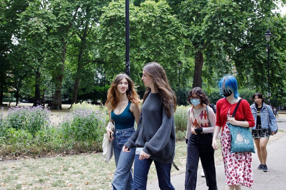 High school students walking in a London park