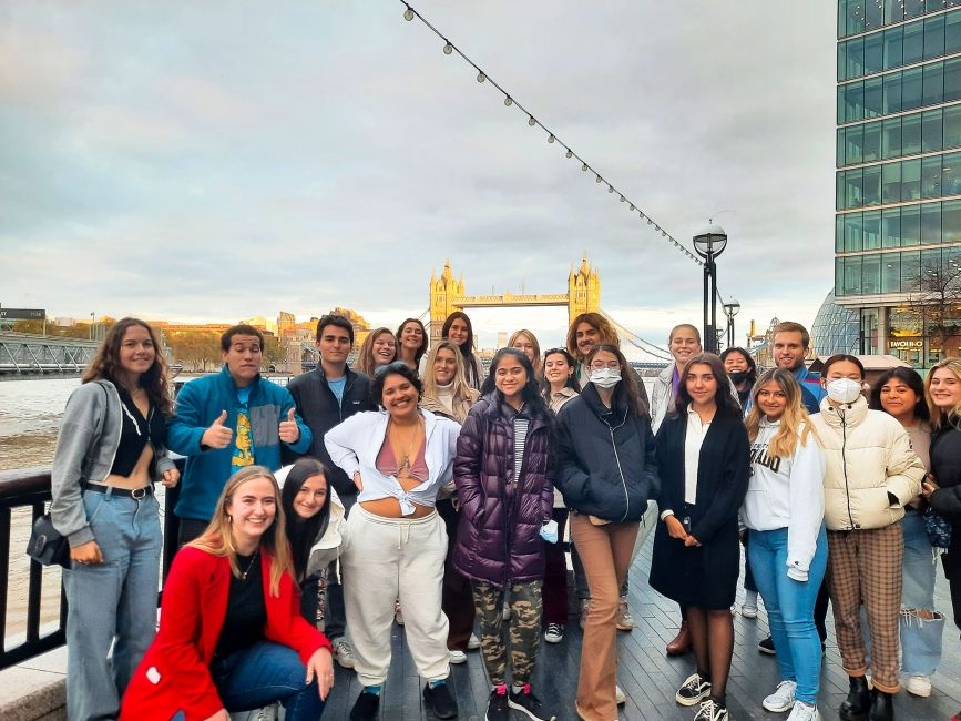 London group of students posing with Tower Bridge