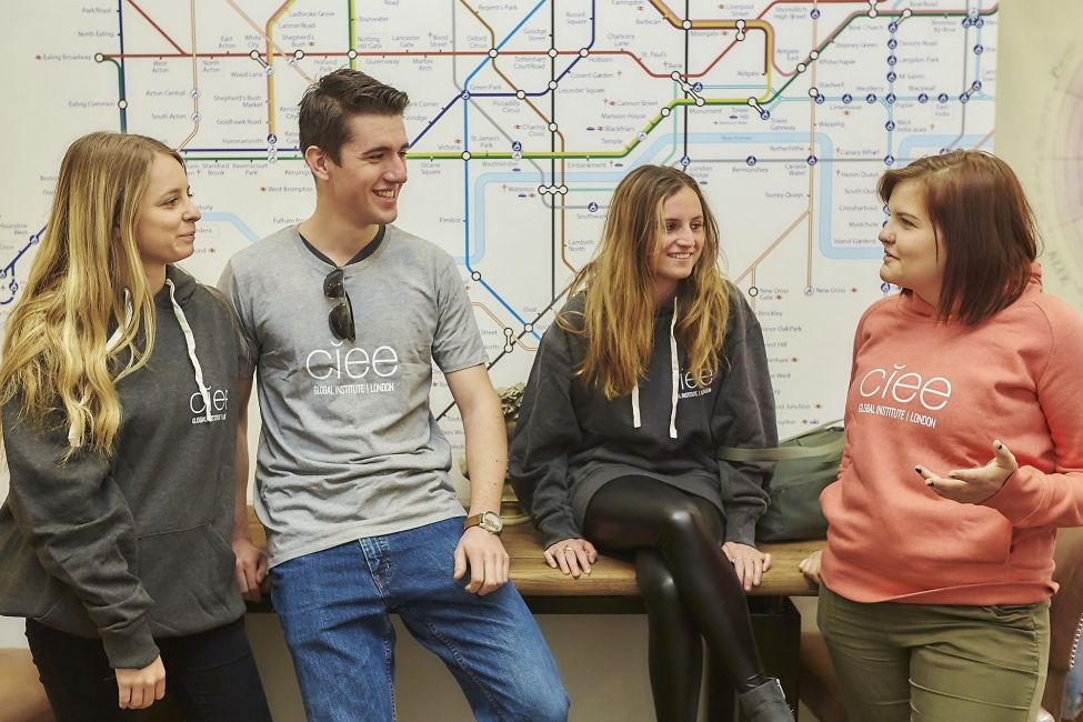 London students wearing CIEE shirts next a tube map