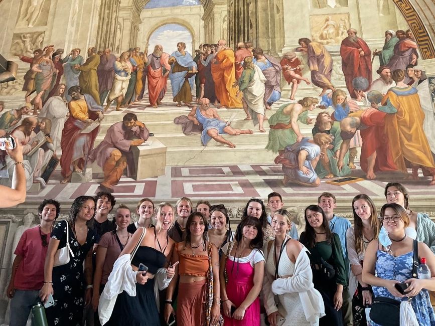 rome group in front of mural