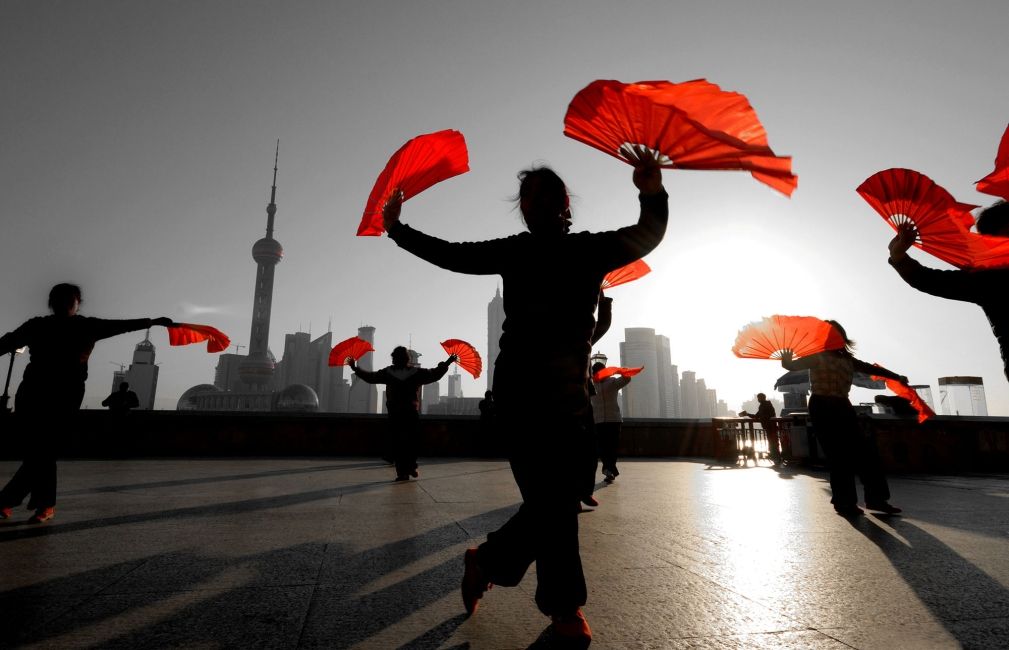 red fans shanghai skyline