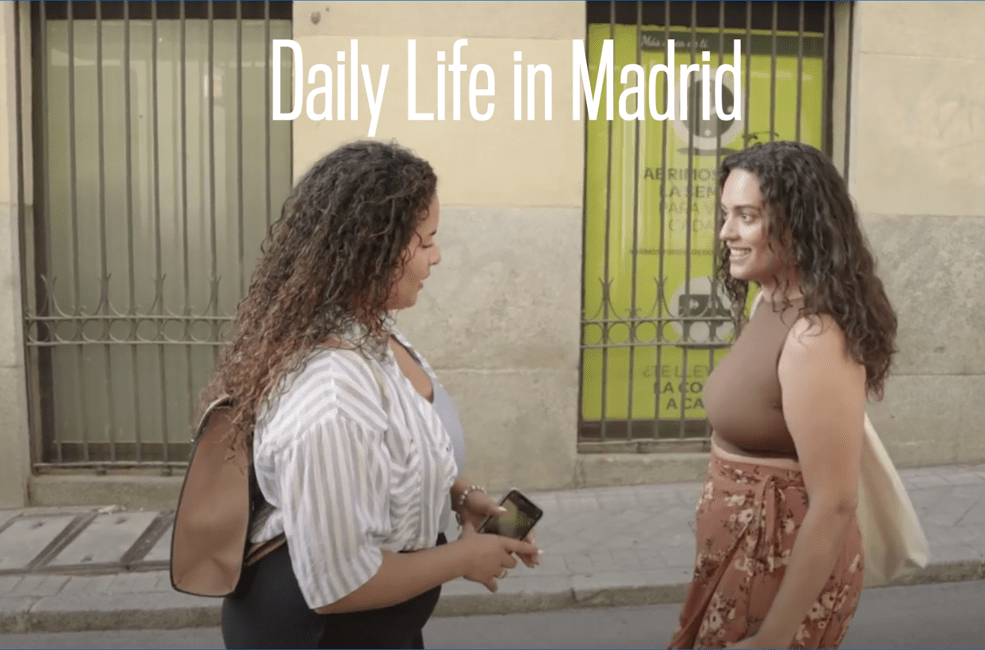 Two women meeting in the street in Madrid