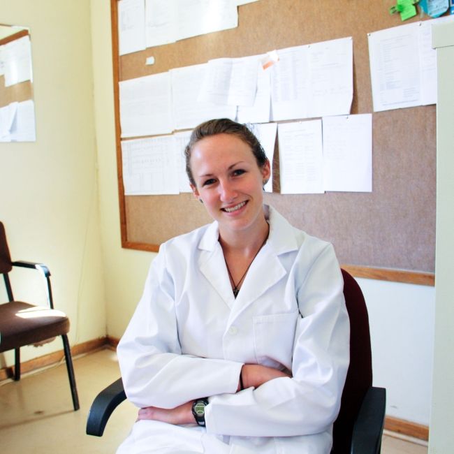 gaborone student in lab coat