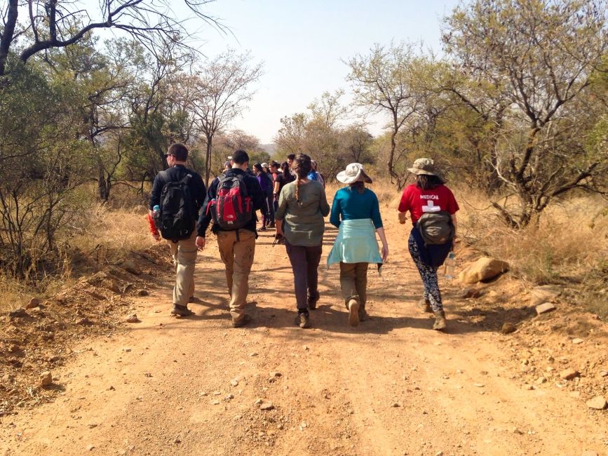 gaborone students on hike walking away from camera