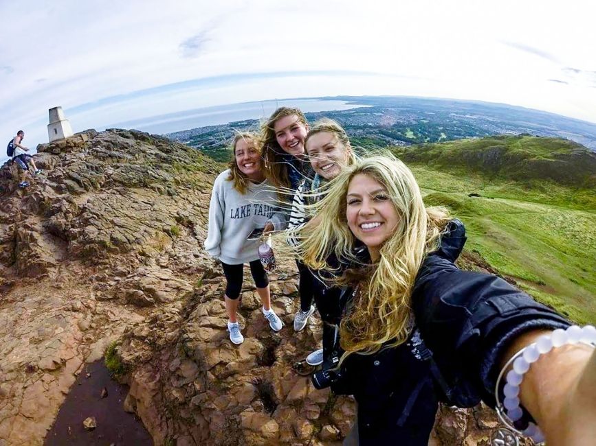 Glasgow girls on cliff taking a selfie together