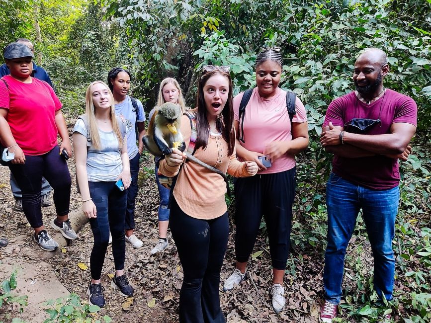 Legon girl with monkey on her arm