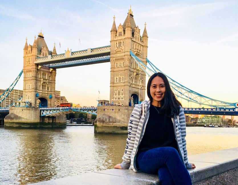 london tower bridge student sitting on wall