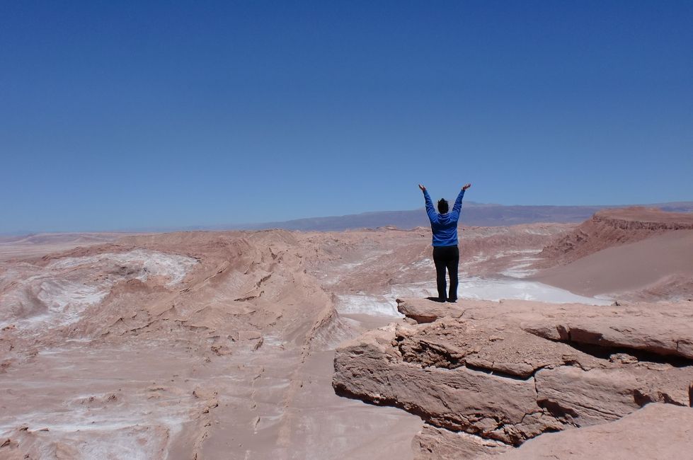 santiago ch student in desert posing with arms up