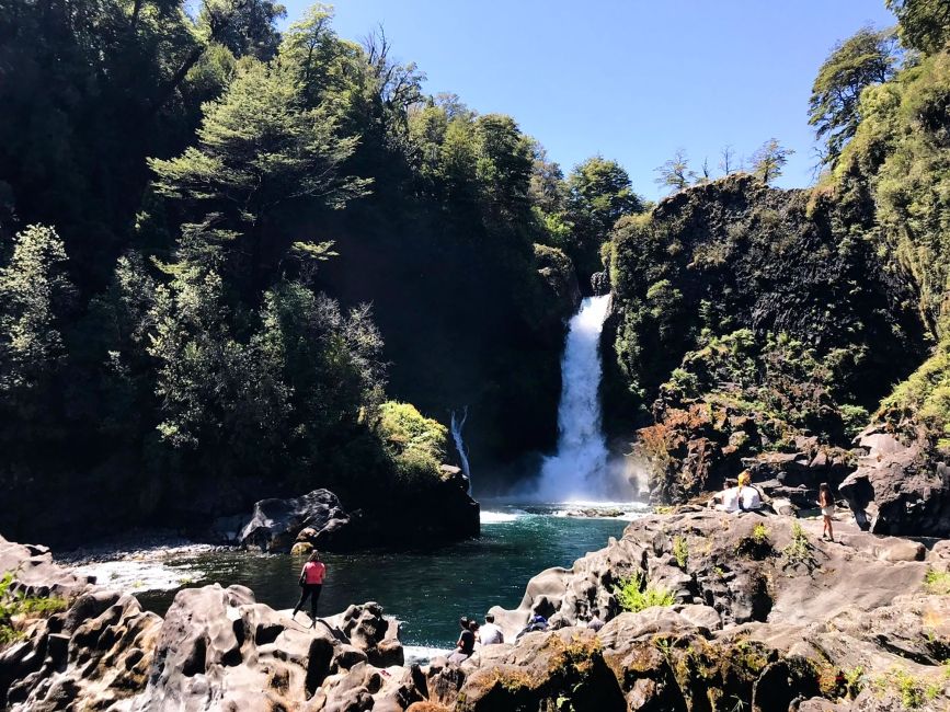 santiago ch waterfall and like with hiker in foreground