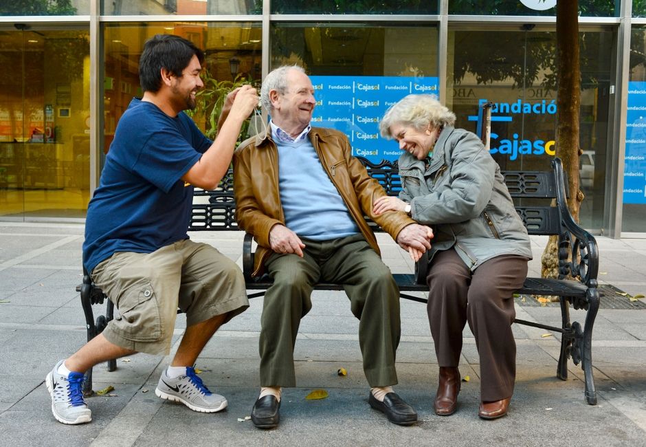seville student taking photo of elderly couple