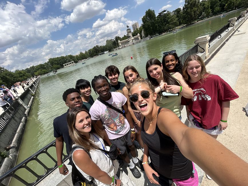 Program leaders and students posing by lake in Mardid