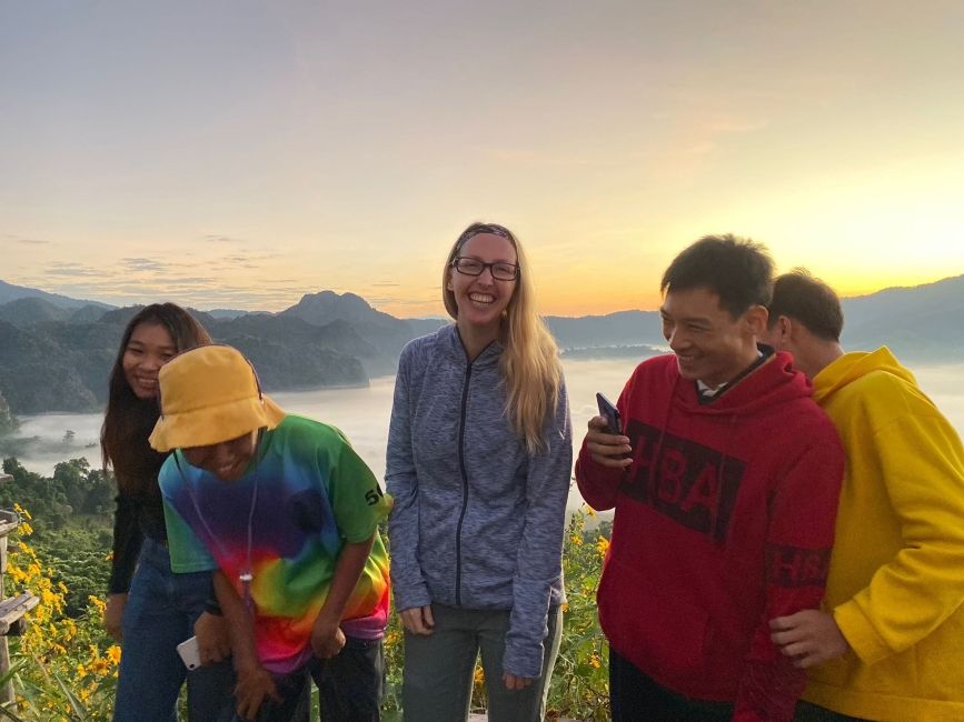 Thailand teacher with coworkers at sunset