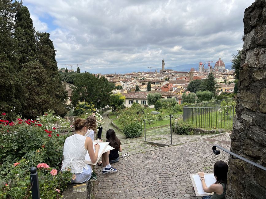 gap year students drawing in garden in europe