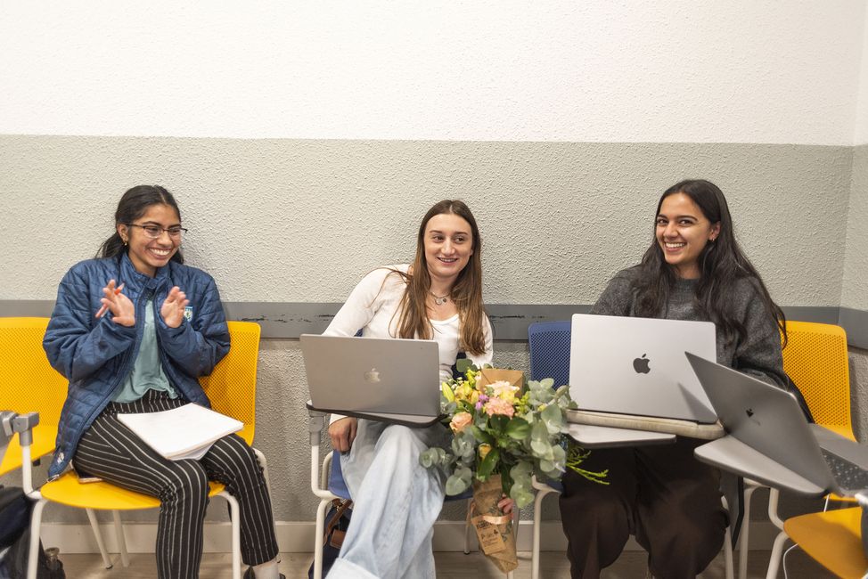 Students abroad in classroom with laptops