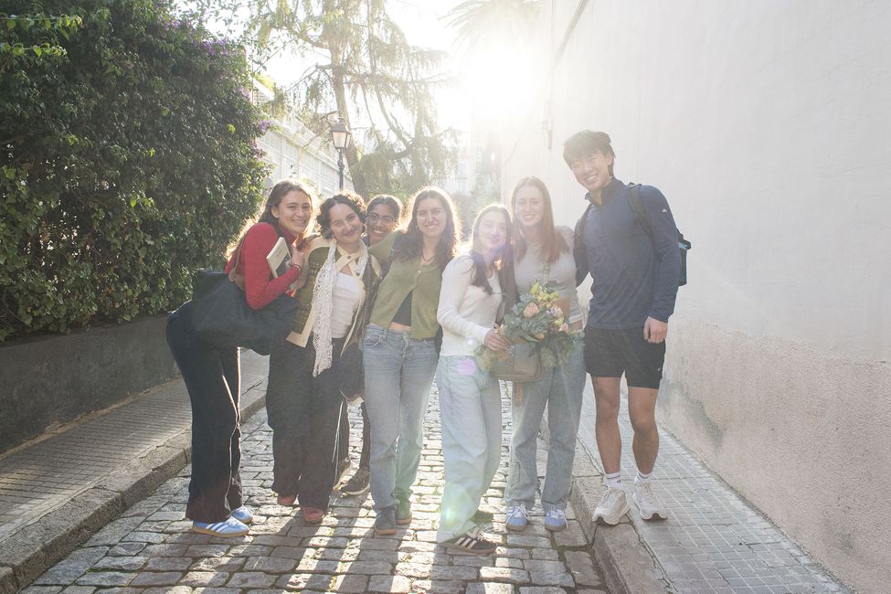 Group of study abroad participants posing on cobblestoned street
