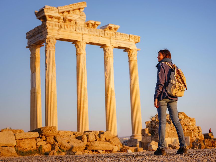 athens-student-backpack-standing-before-column-ruins