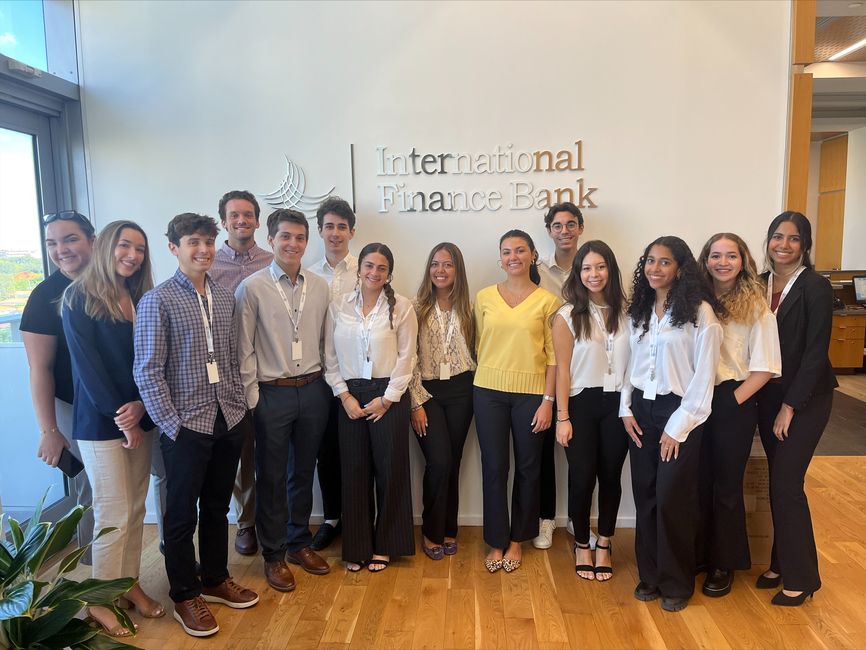 Pierre Henri poses with his coworkers at the International Finance Bank in Miami, Florida.