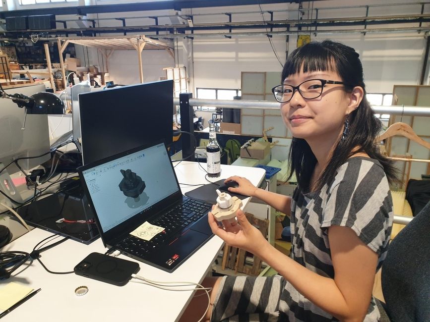 A CIEE intern works at her desk.