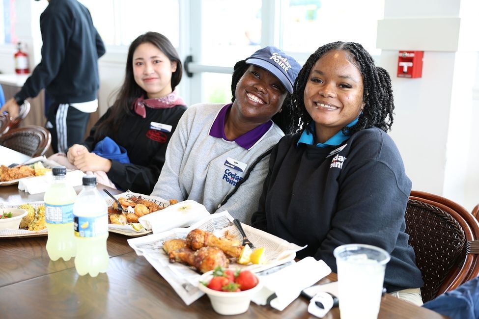 3-participants-eating-women-smiling