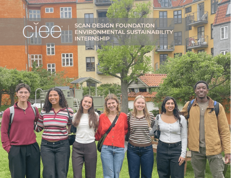 Logo top left: CIEE Scan Design Environmental Sustainability Internship above seven students (ages 19-22, 2 male, 5 female) who are shoulder-to-shoulder and smiling in an outdoor setting