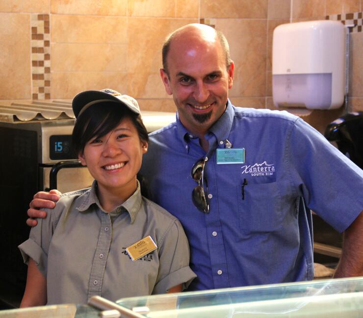 A Xanterra Travel Collection manager poses with a Summer Work Travel participant.