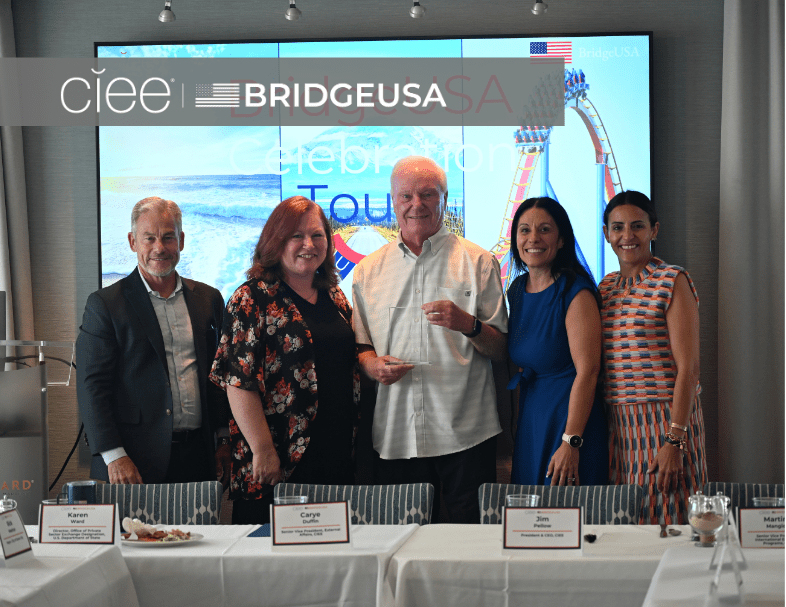 CIEE and BridgeUSA representatives pose with an award recipient during a BridgeUSA Celebration Tour even