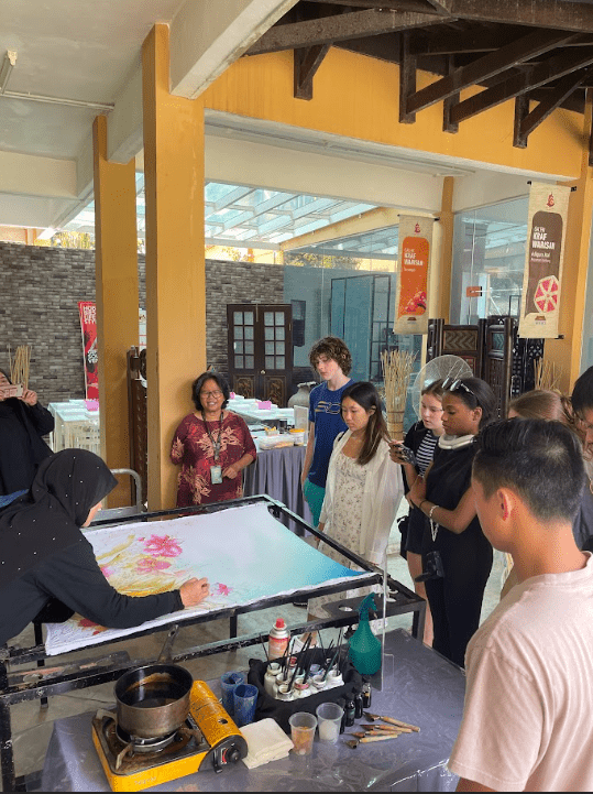 Local artists showed the group the batik technique on this large fabric canvas.