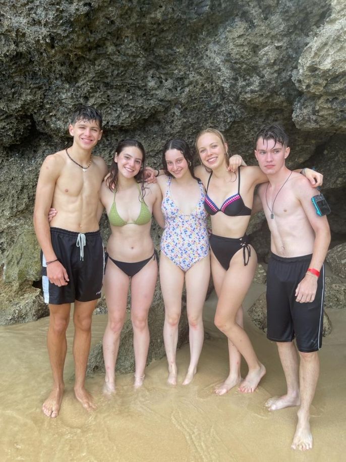 the students feeling nice near a cave at the natural pool