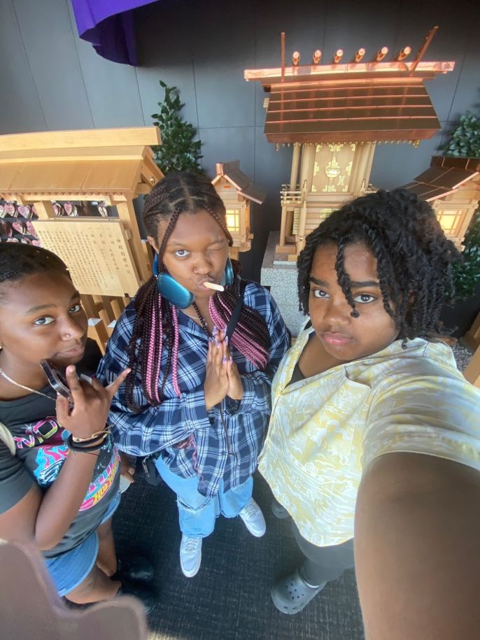 Tiffanie, Taniya, and Ariana taking a selfie in front of the Shinto Shrine inside of Tokyo Tower