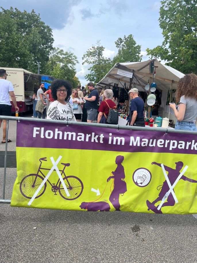 A student standing in the flea market at Mauerpark