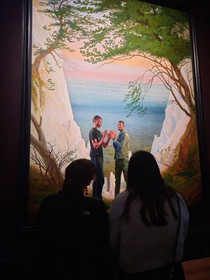 Two students looking at Kehinde Wiley Artwork at the National Gallery